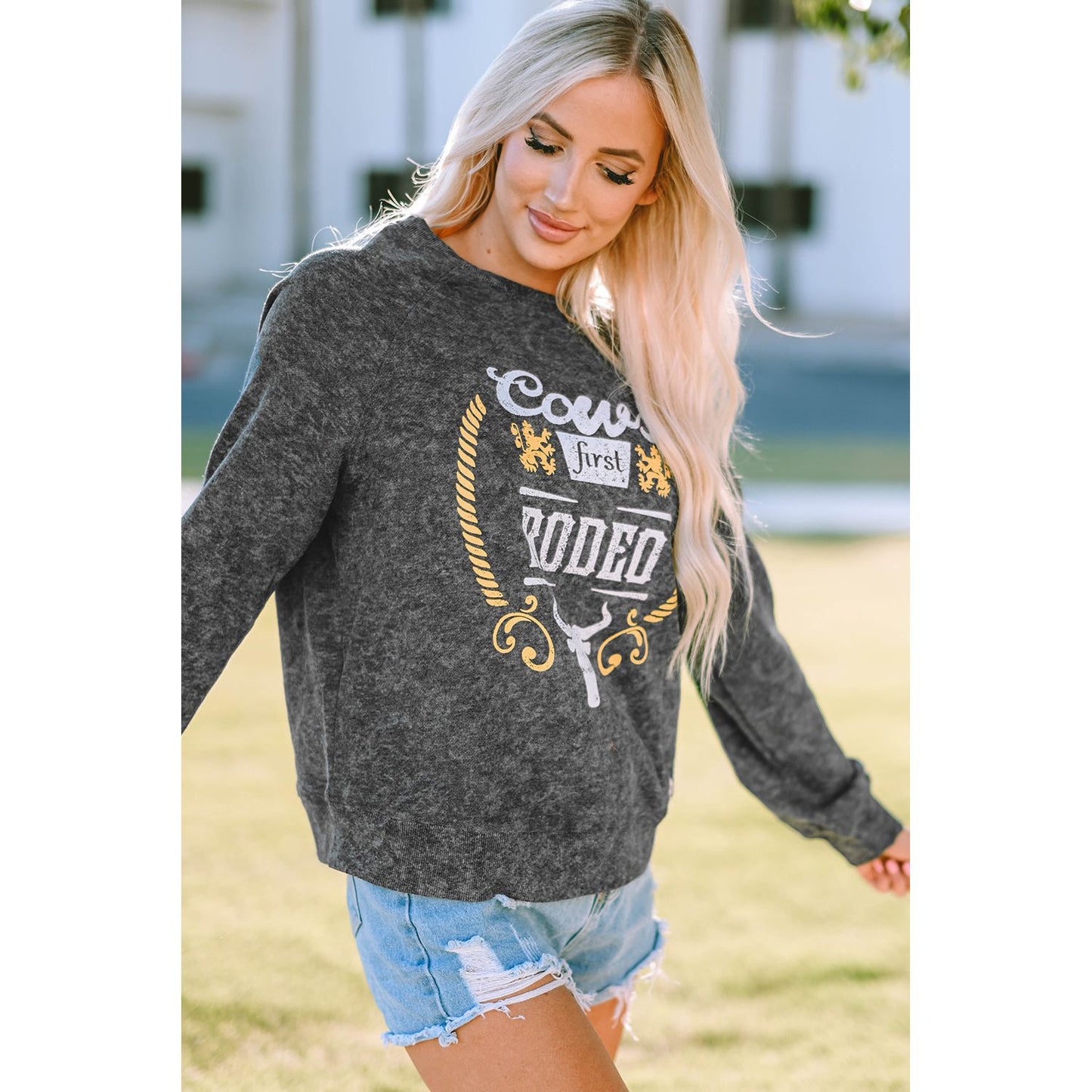 Mineral Washed COW'S FIRST RODEO Round Neck Raglan Sleeve Sweatshirt