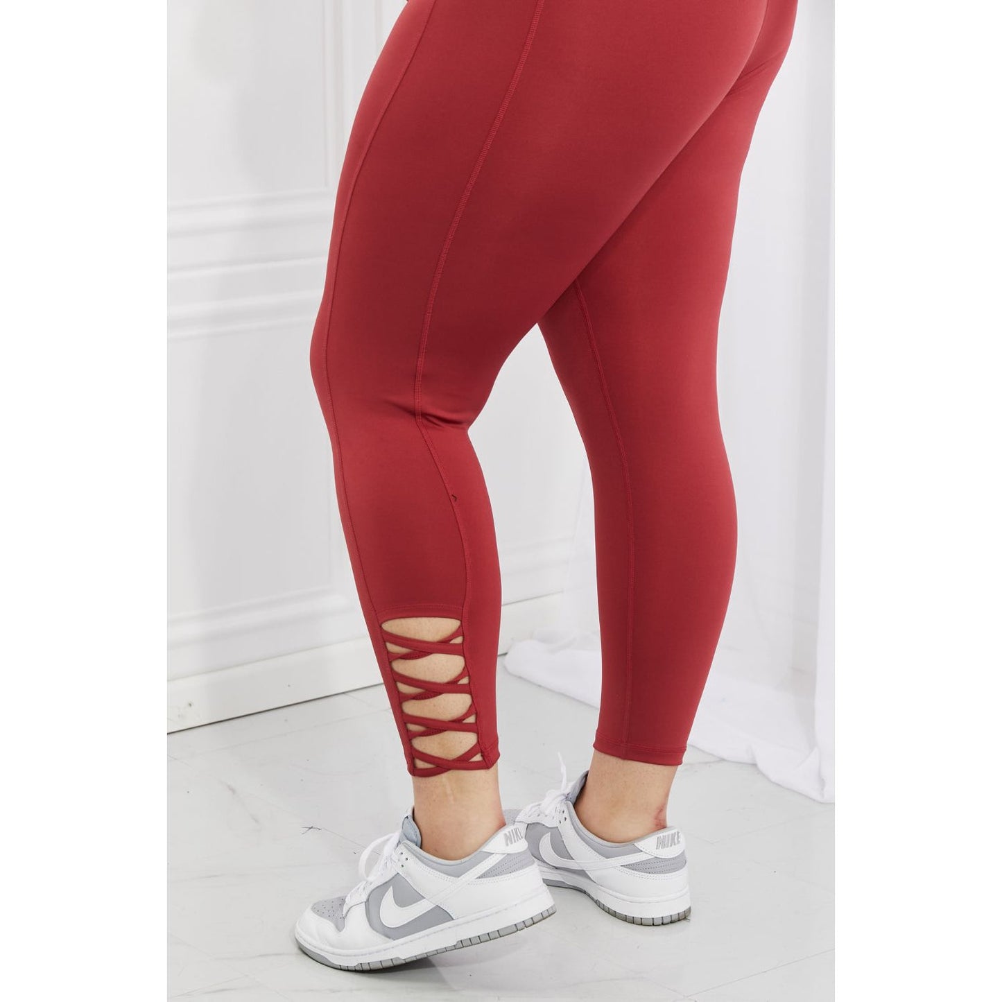 Yelete Ready For Action Full Size Ankle Cutout Active Leggings in Brick Red